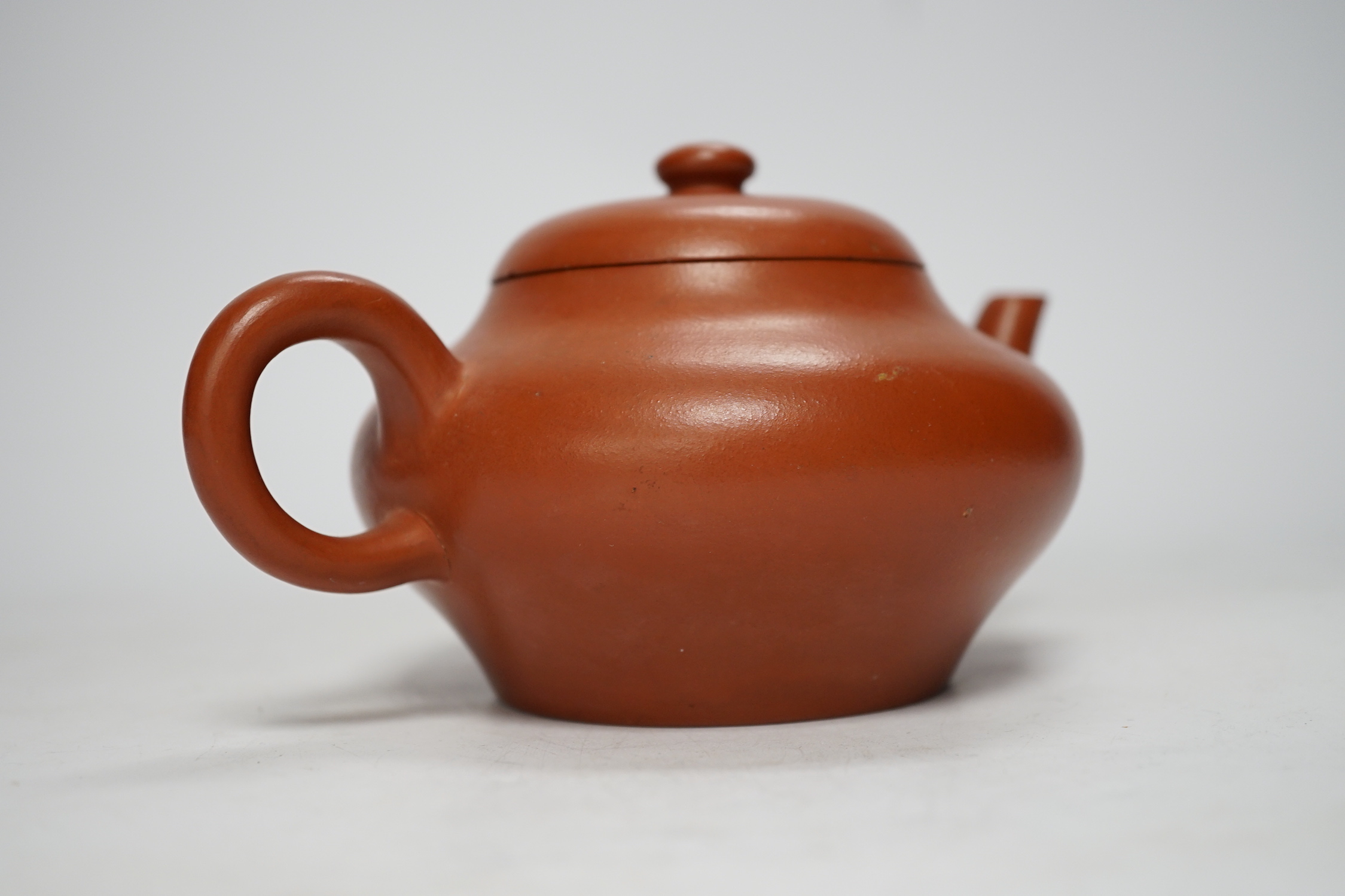 A 19th century Chinese Yixing teapot and cover, possibly for the Thai market, 9cm tall